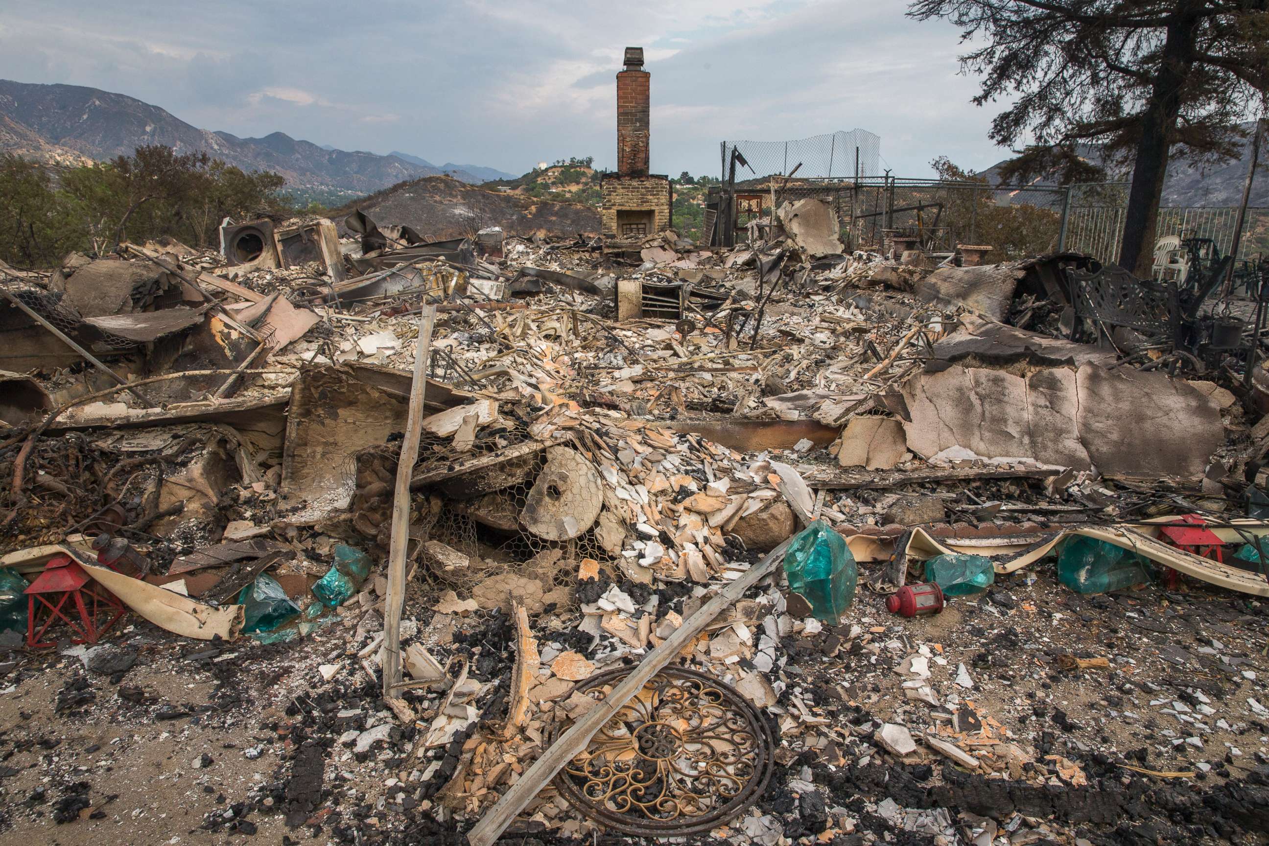 PHOTO: A home and property lie in ruins destroyed in the La Tuna Canyon fire along Crestline Drive in the Verdugo Mountains north of downtown Los Angeles.