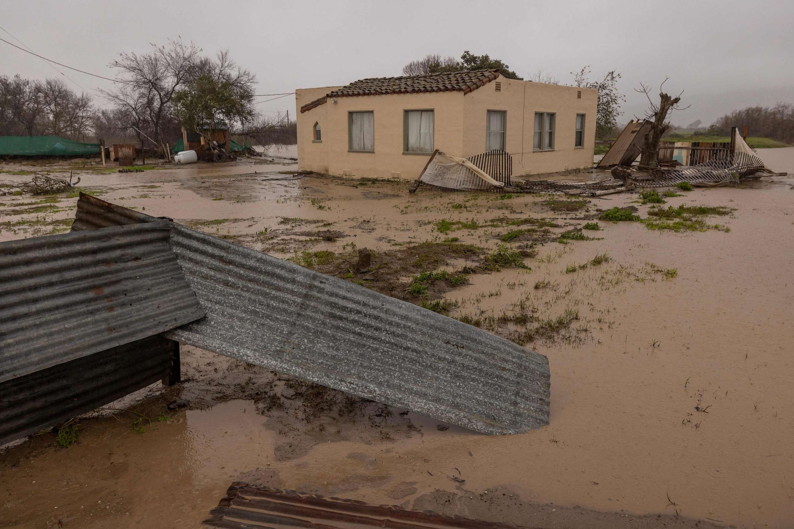 PHOTO: Flood waters inundate a home by the Salinas River near Chualar, California, on on January 14, 2023, as a series of atmospheric river storms continue to cause widespread destruction across the state.