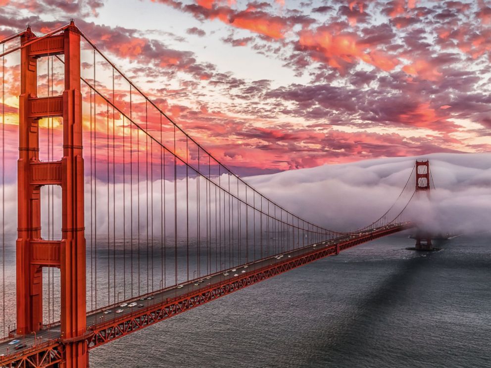 PHOTO: Heavy fog at sunset surrounds the south tower of the Golden Gate Bridge in San Francisco, Jan. 27, 2014.