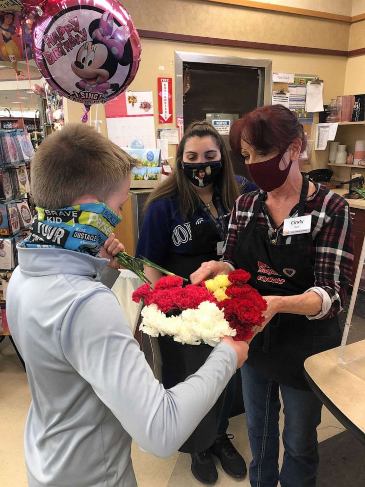 JJ went to two King Soopers locations in Brighton and Commerce City to share flowers with employees