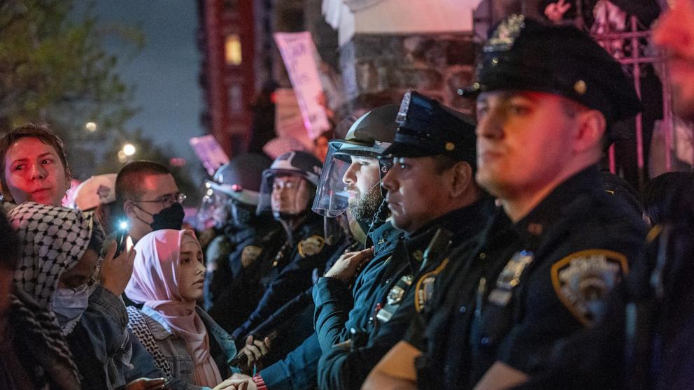 PHOTO: Pro-Palestinian supporters confront police during demonstrations at The City College Of New York as the NYPD cracks down on protest camps at both Columbia University and CCNY on April 30, 2024 in New York City.
