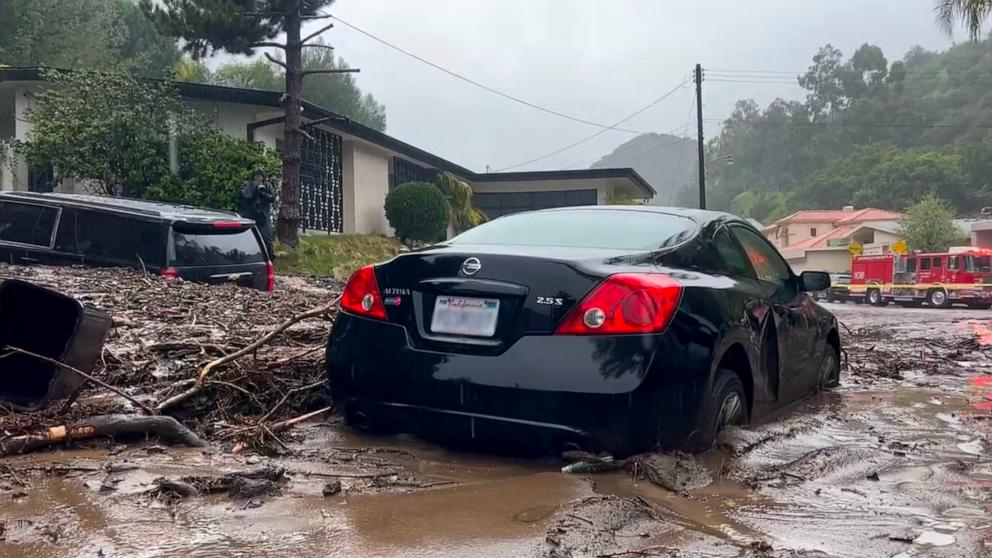 PHOTO: A car gets trapped in a mudslide in Beverly Hills, CA, Feb. 5, 2024.