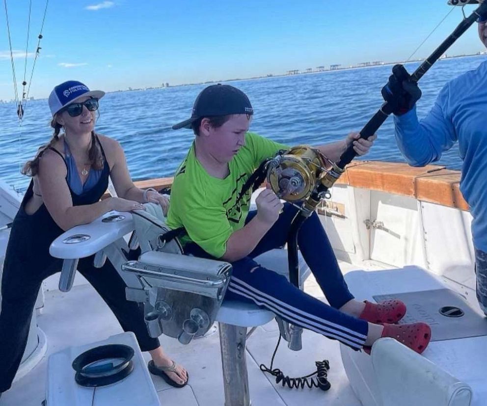 PHOTO: 12-year-old Cambell Keenan reels in a great white shark while fishing in Florida.