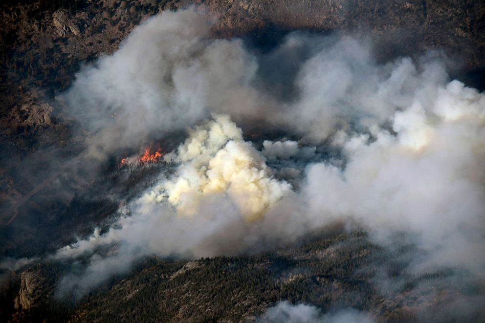 PHOTO: Heavy Smoke and flames rise from the Cameron Peak fire as the fire continues to burn, Oct. 5, 2020, in Larimer County near Fort Collins, Colo. 