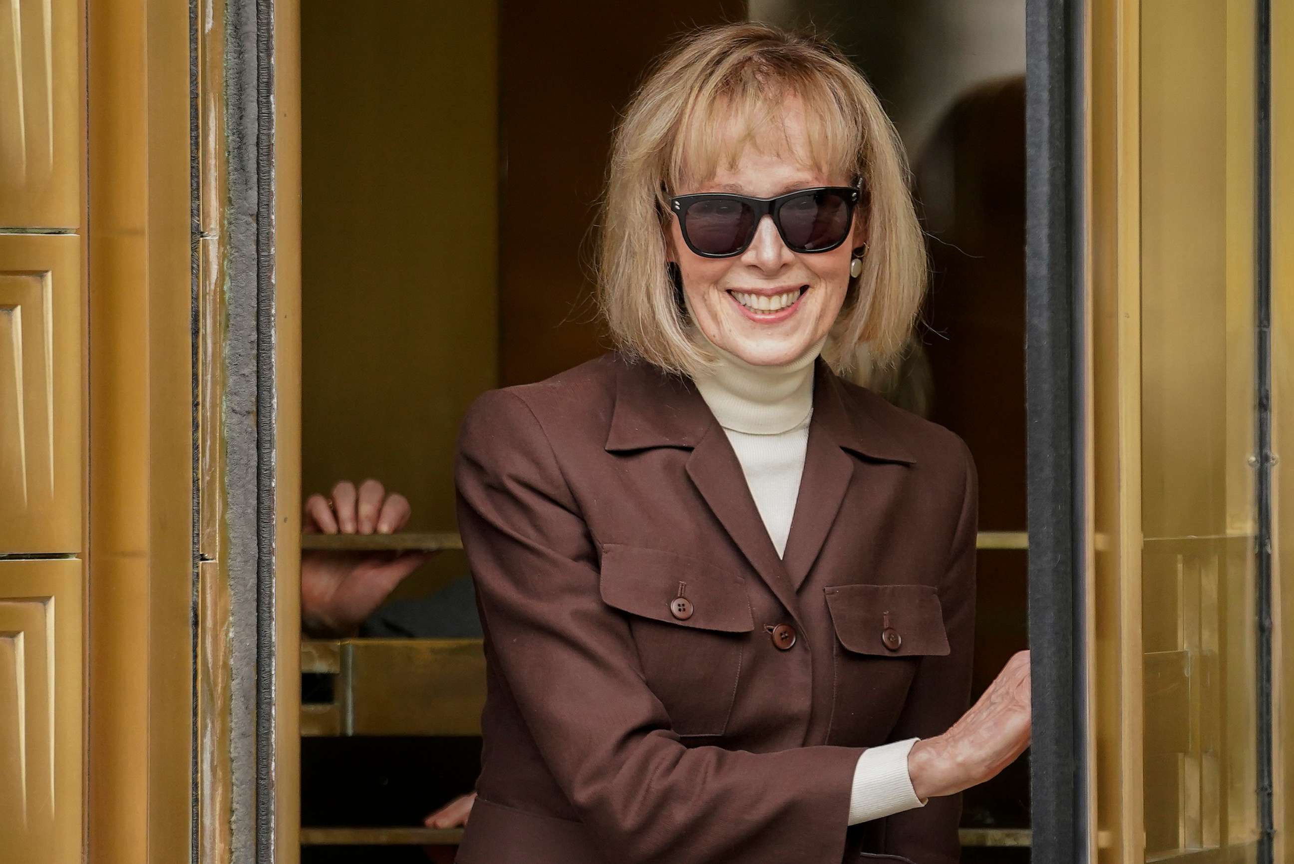 PHOTO: E. Jean Carroll walks out of Manhattan federal court, May 9, 2023, in New York.