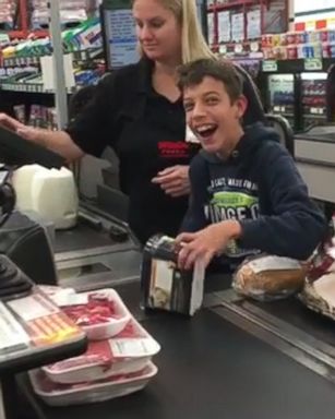 A small and simple gesture of a cashier letting a boy help her scan food items helped make the day of a boy with cerebral palsy.