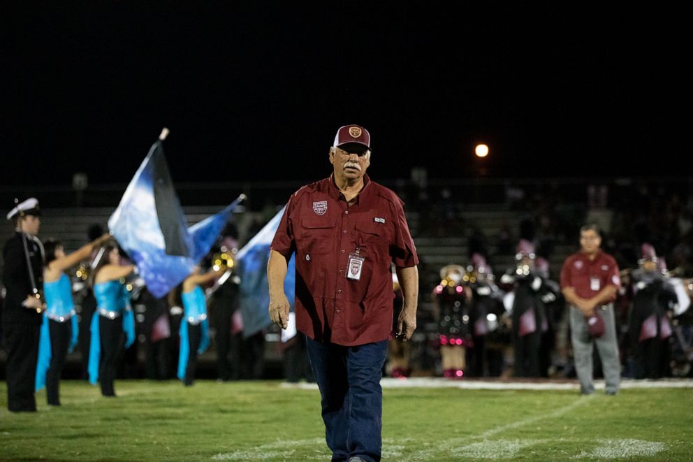 PHOTO: Carlos "Charlie" Ramos of the 1972 championship Uvalde football team takes the field on Sept 2, 2022.