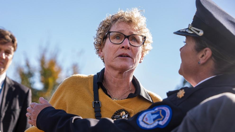 PHOTO: Rep. Chrissy Houlahan is interrupted by Capitol Police while questioning Speaker of the House Mike Johnson during a House Republican news conference about the government shutdown on the House steps of the U.S. Capitol, November 5, 2025.