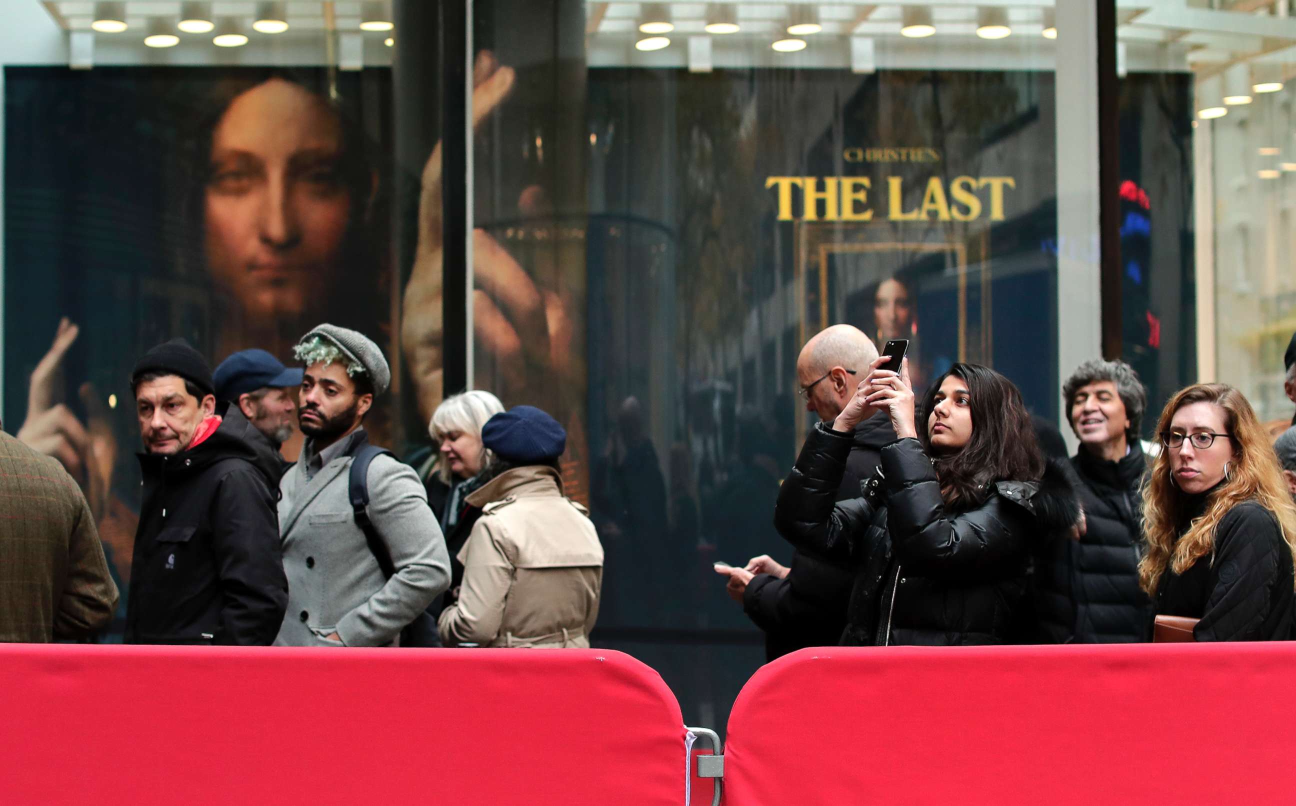 PHOTO: Visitors wait outside Christie's to view Leonardo da Vinci's "Salvator Mundi", Nov. 14, 2017, in New York. The painting is expected to sell at auction for $100 million on Wednesday.
