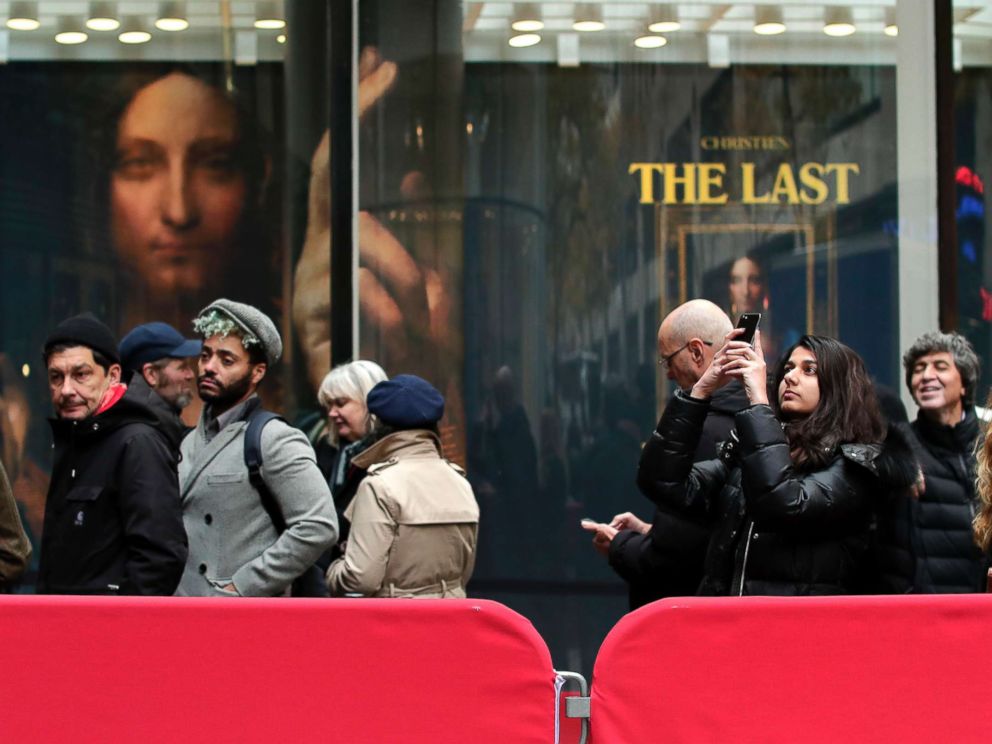 PHOTO: Visitors wait outside Christies to view Leonardo da Vincis Salvator Mundi, Nov. 14, 2017, in New York. The painting is expected to sell at auction for $100 million on Wednesday.
