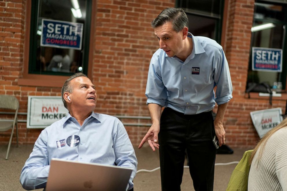 PHOTO: Rhode Island General Treasurer and Democratic candidate for the state's 2nd Congressional District, Seth Magaziner, right, talks with Rep. David Cicilline, as they make calls to voters from a campaign office in Providence, R.I., Nov. 7, 2022.