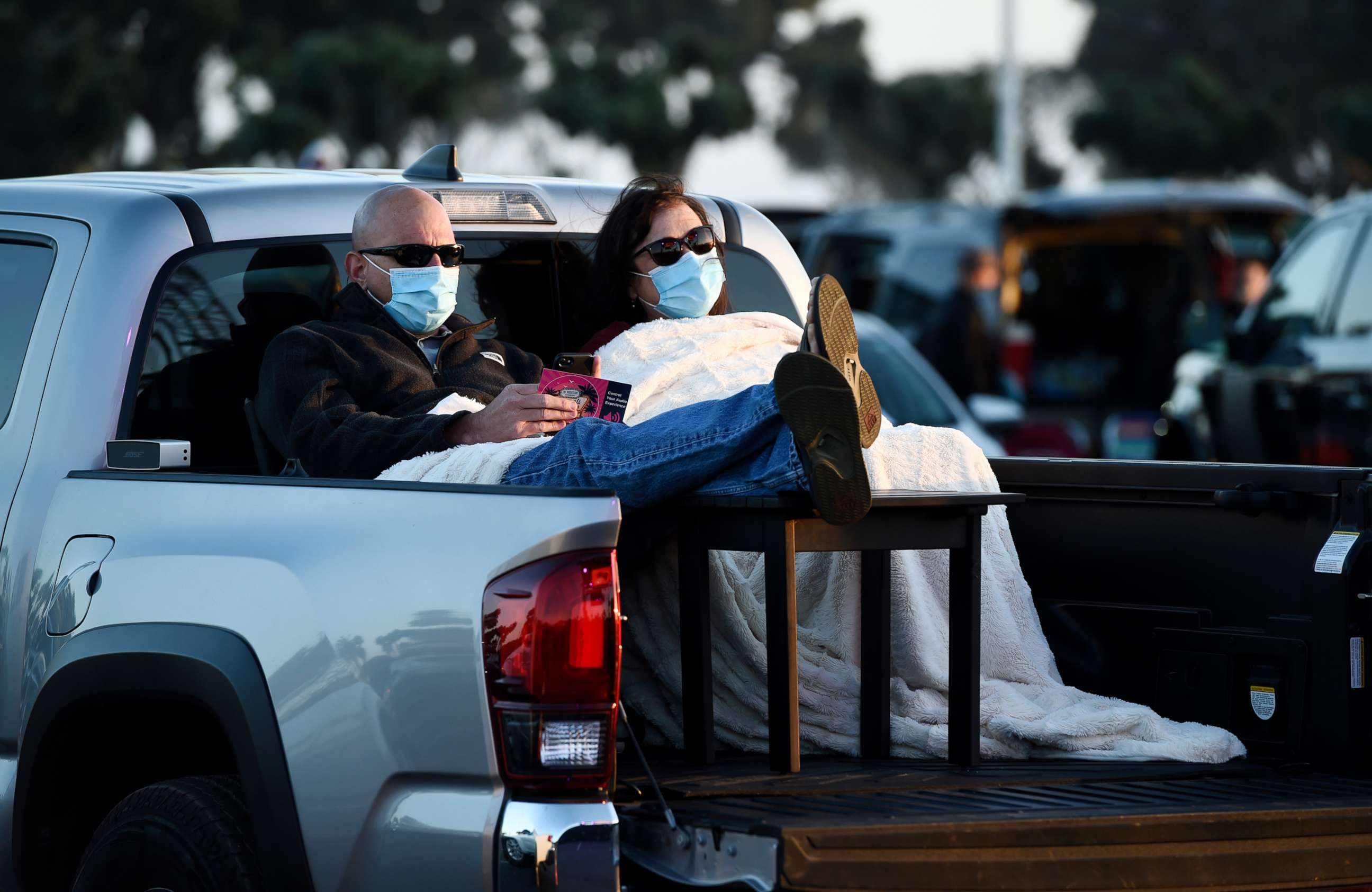 PHOTO: Chris Cdebaca of Oxnard, Calif. and his wife Avonna Ramsey await the start of Third Eye Blind's performance at Concerts in your Car at the Ventura County Fairgrounds on Saturday, July 25, 2020, in Ventura, Calif.