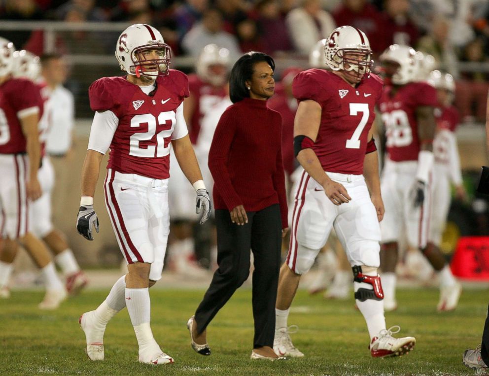 PHOTO: Honorary Stanford captain Condoleezza Rice walks to the middle of the field for the coin toss with the Stanford Cardinals before their game against the Notre Dame Fighting Irish at Stanford Stadium, Nov. 28, 2009 in Palo Alto, Calif.  