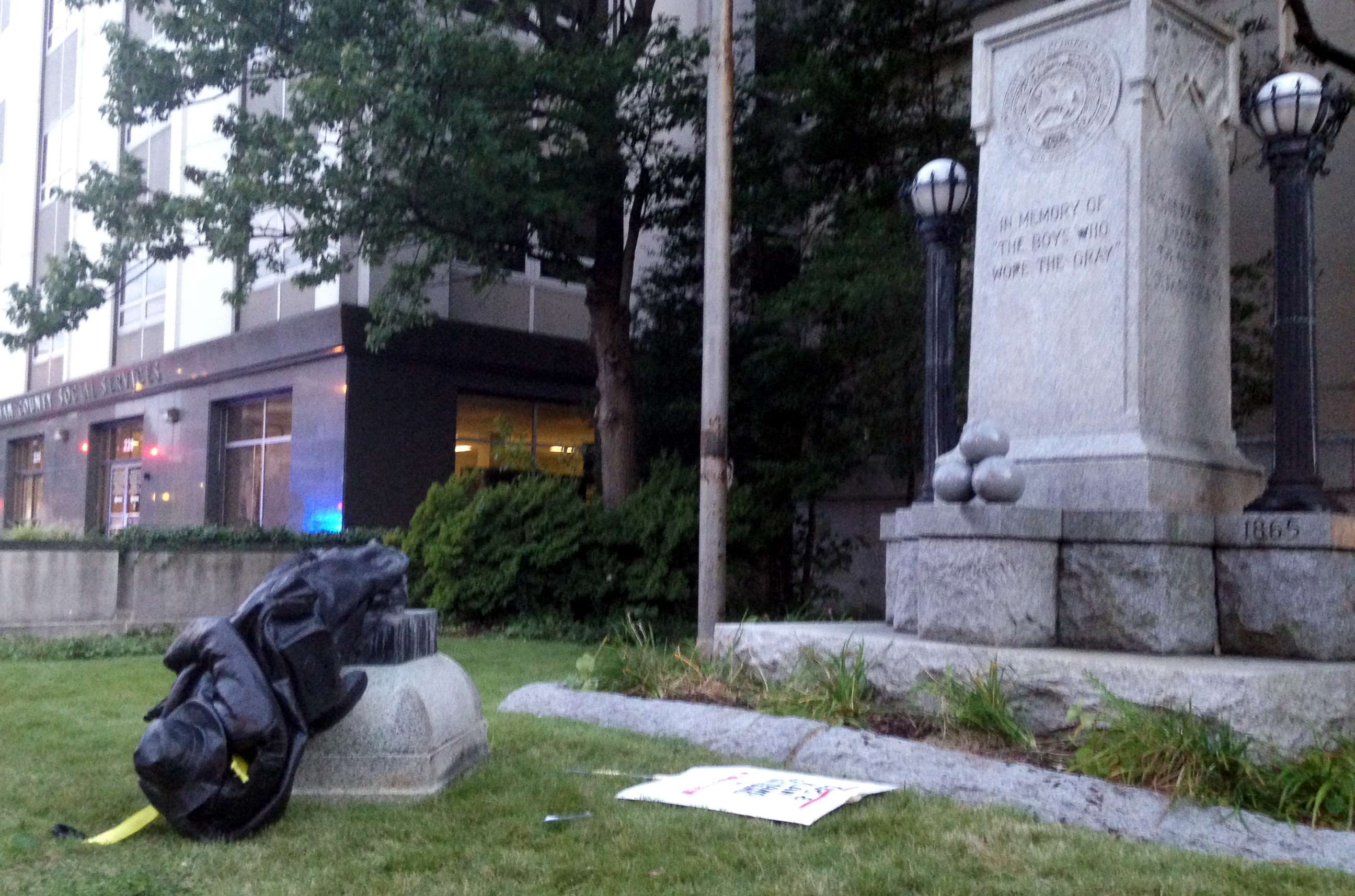 PHOTO: A toppled Confederate statue lies on the ground on Aug. 14, 2017, in Durham, N.C. Activists on Monday evening used a rope to pull down the monument outside a Durham courthouse in response to the events in Charlottesville over the weekend.