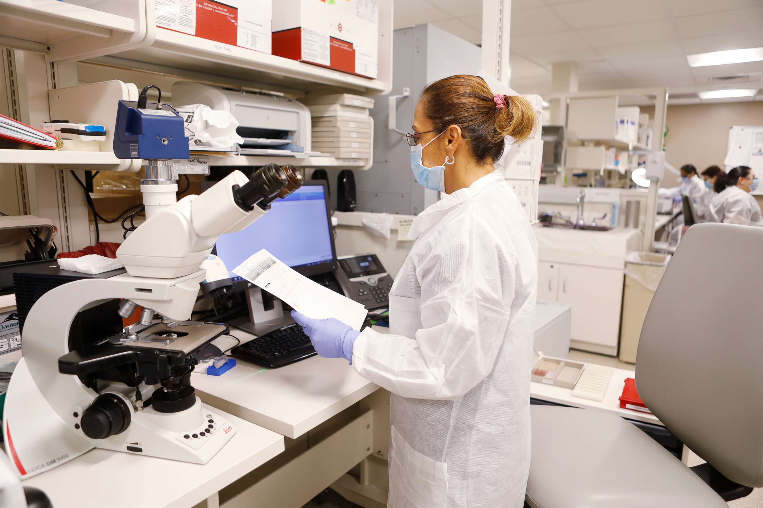 PHOTO: Adriana Cardenas, a medical technologist processes test samples for the coronavirus at the AdventHealth Tampa labs on June 25, 2020 in Tampa, Florida. 