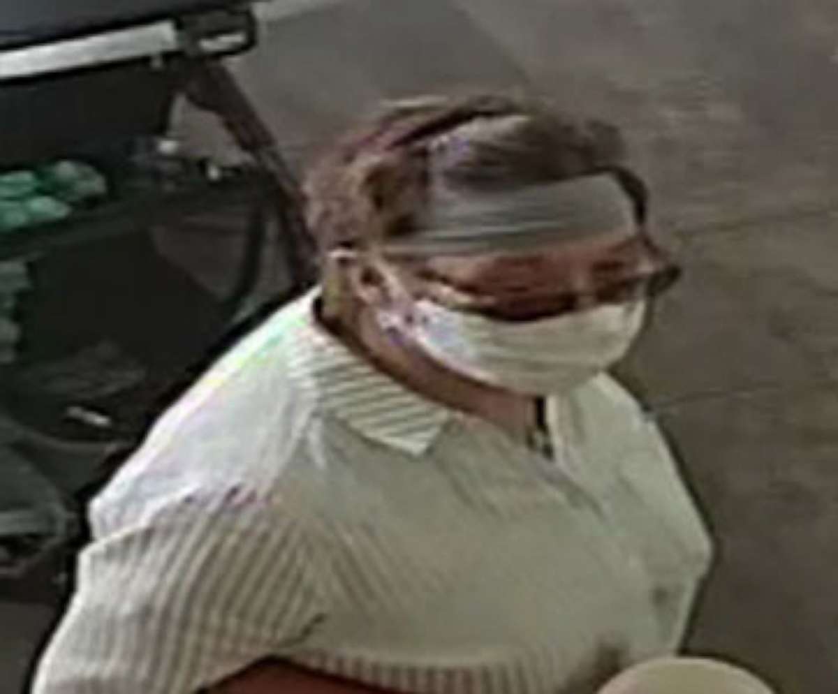 PHOTO: Police are looking for a white female in her 60s, medium build, wearing a gray bandana, glasses and a long sleeve shirt with gray vertical lines after she coughed on a 1-year-old baby at a Yogurtland in San Jose, California on June 12, 2020.