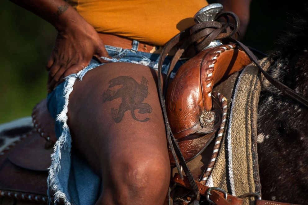 PHOTO: A thigh tattoo is revealed on the leg of a cowgirl named Pam in Tallahatchie County, Miss.