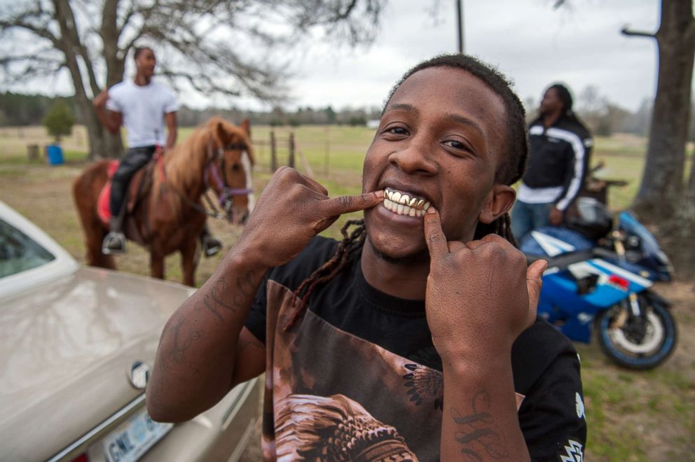 PHOTO: Ladarius shows off his golden grill at a trail ride in Charleston, Miss.