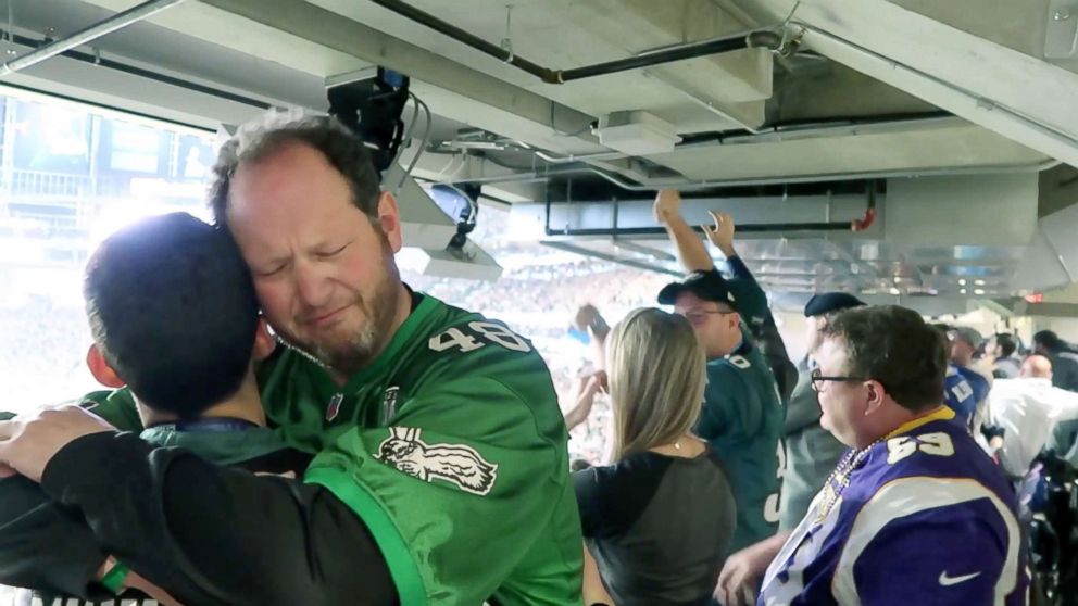 PHOTO: A father and son embrace after the Philadelphia Eagles won Super Bowl LII. 