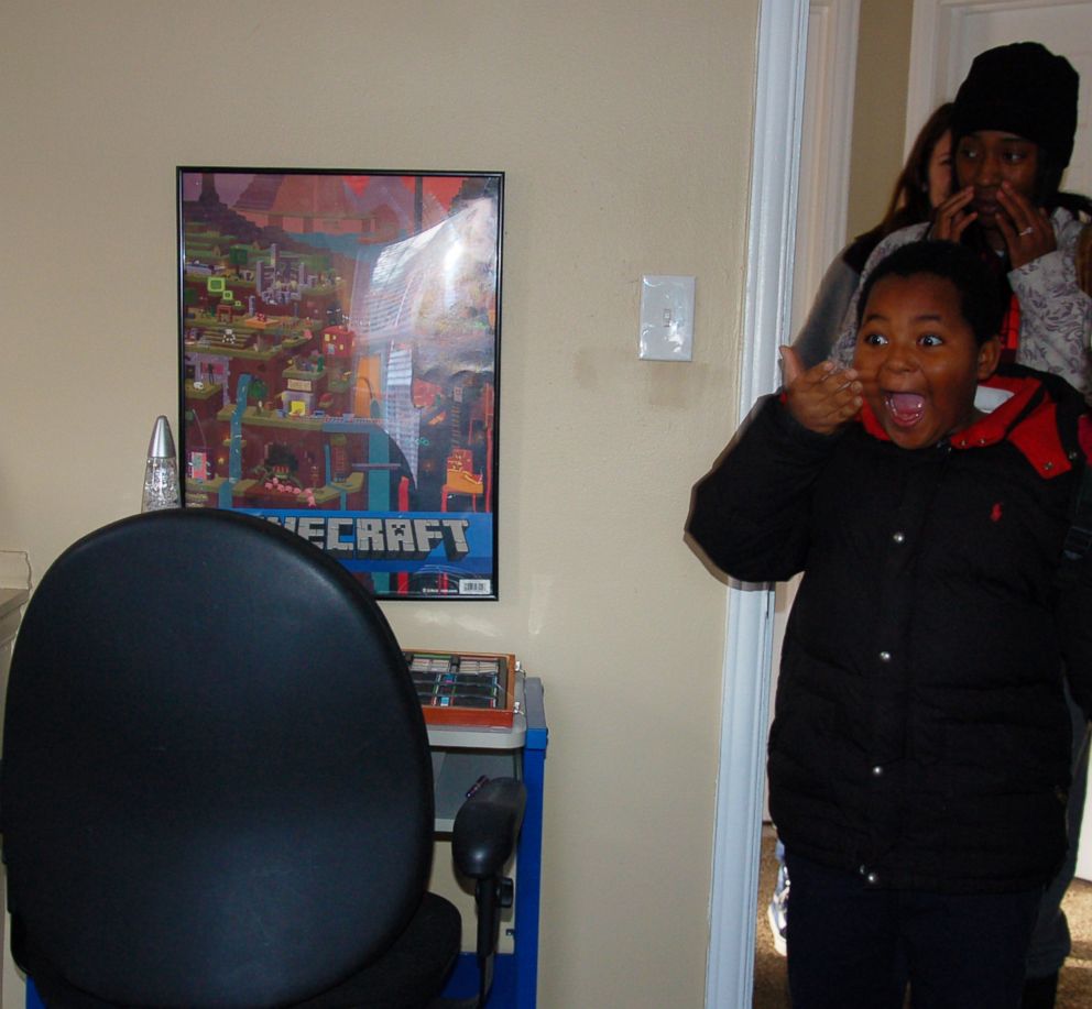 PHOTO: Daerye Neely, 8, of Detroit, could not contain his surprise seeing his newly furnished home. After the initial shock, he broke down in tears and hugged his mom Dec. 15, 2017.