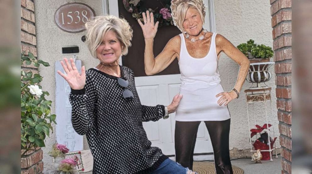 PHOTO: Debbie Hays (left) pictured with a cutout image of herself to display in her mom's room, who is battling COVID-19. 