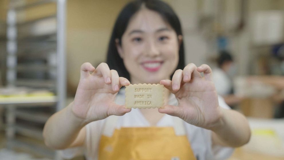 PHOTO: Owner Celine Zhou shows "World News Tonight" a customized cookie in at "Delight Patisserie" in Los Angeles, California.