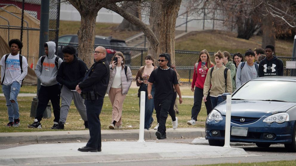 PHOTO: Students are walked out of East High School following a shooting, March 22, 2023, in Denver.