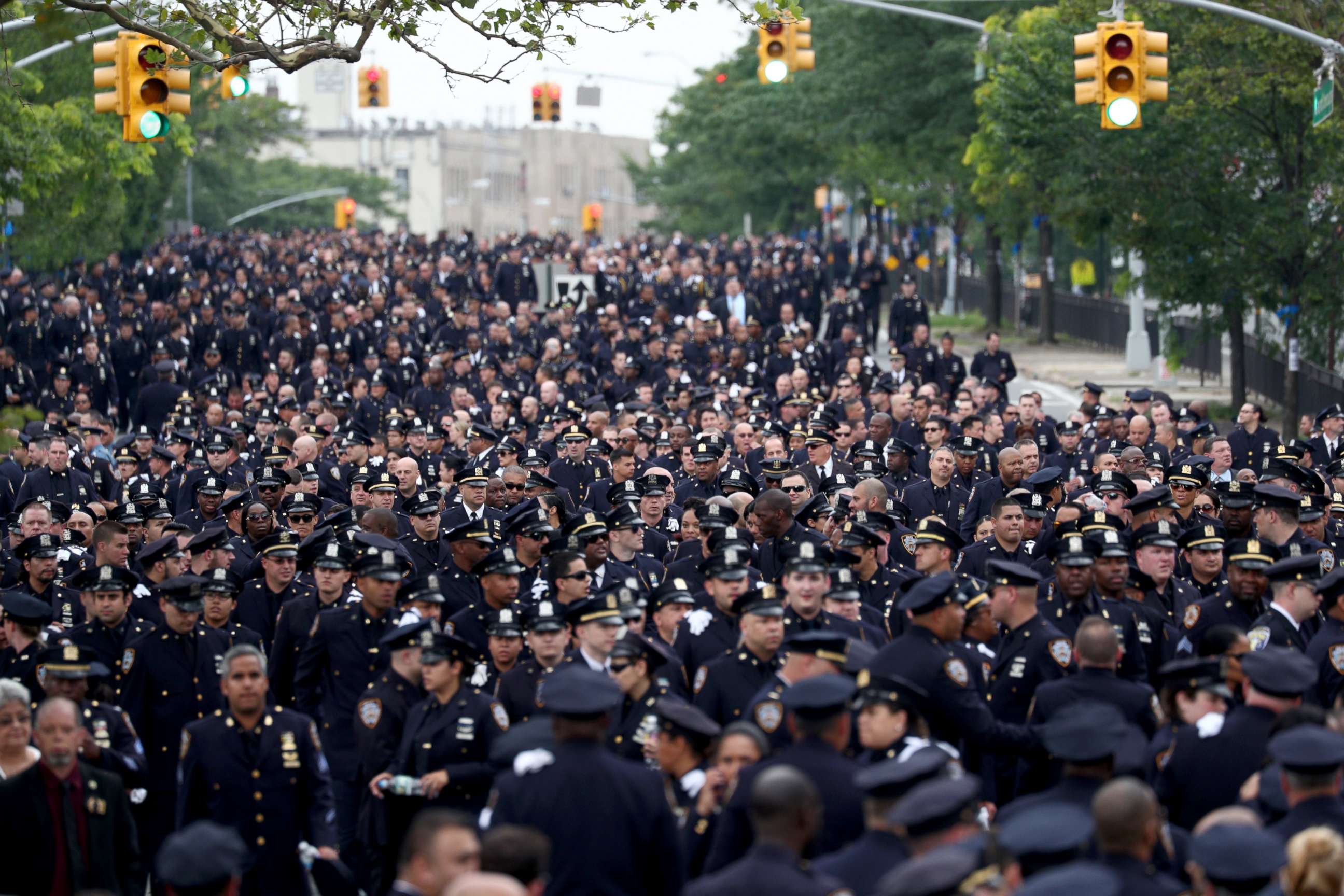 PHOTO: Police officers line up outside the funeral of slain New York Police Department (NYPD) Officer, Miosotis Familia, outside of the World Changers Church in the Bronx, New York, July 11, 2017.