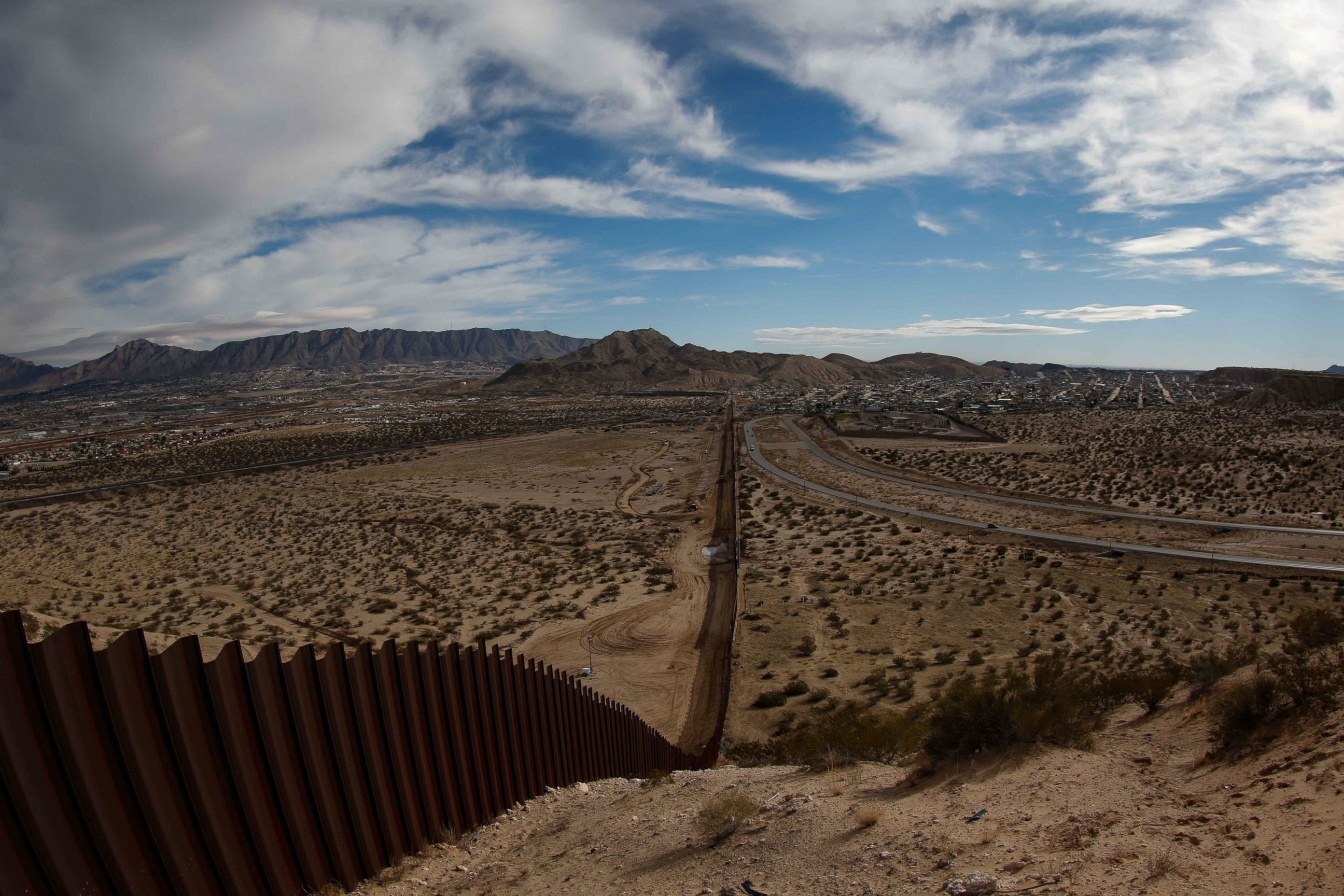 PHOTO: View of the border fence between the US states of Texas and New Mexico, left, and Ciudad Juarez, Mexico, right, on Jan. 25, 2017.