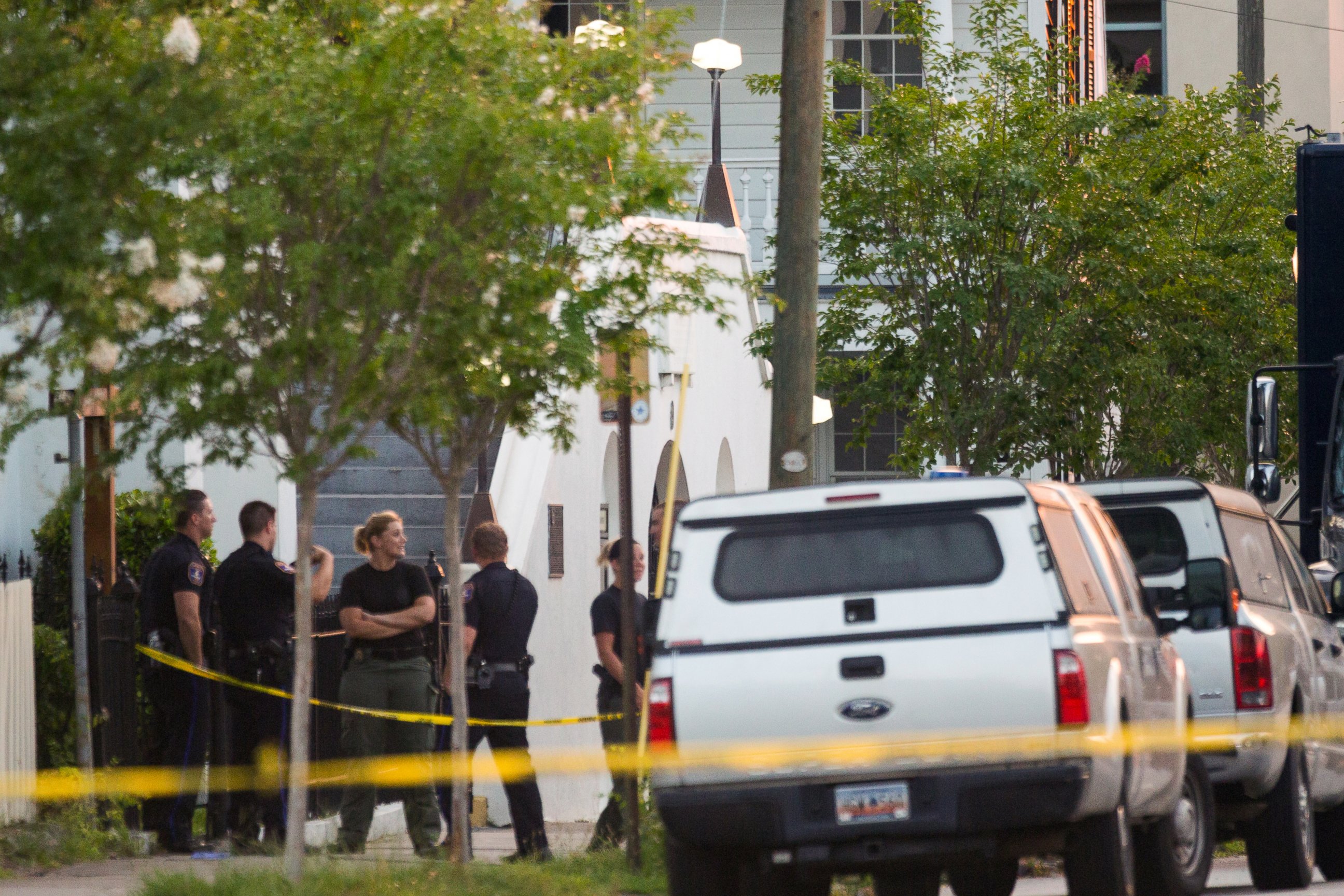 PHOTO: Police investigators continue to work the scene at historic Mother Emanuel African Methodist Episcopal Church at dawn where a gunman opened fire on a prayer meeting killing nine people in Charleston, South Carolina, June 18, 2015. 