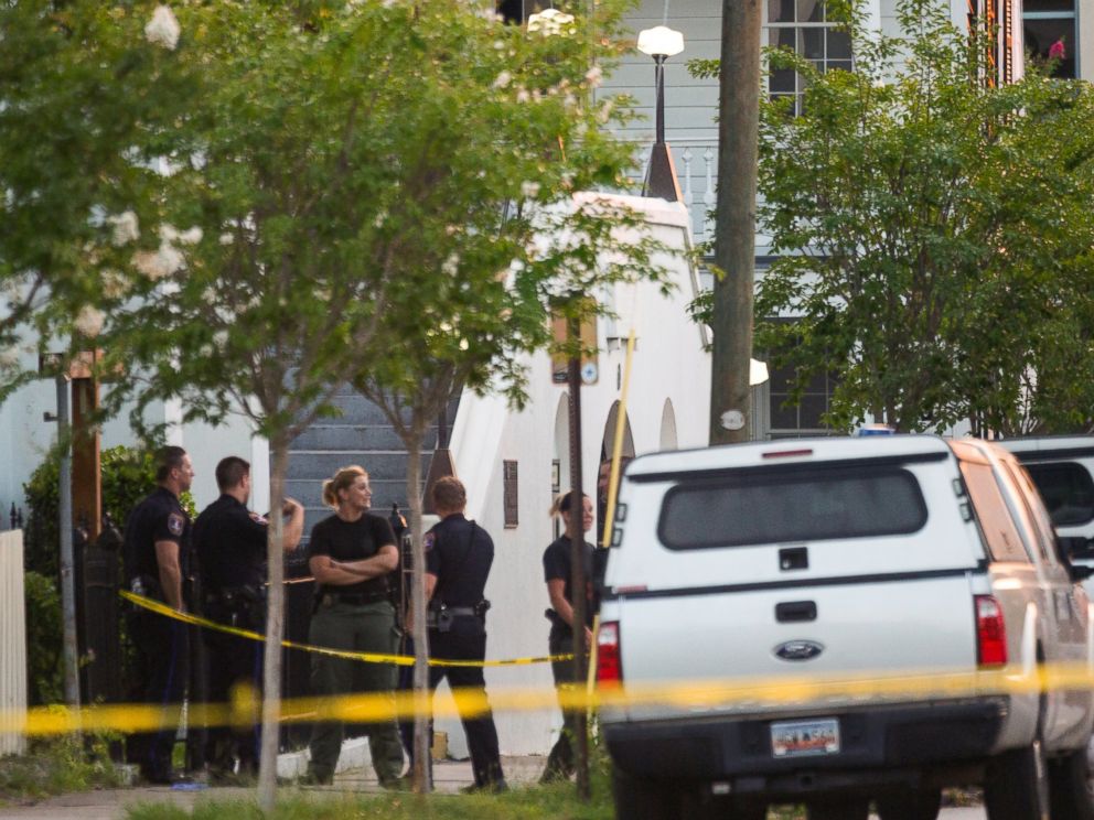 PHOTO: Police investigators continue to work the scene at historic Mother Emanuel African Methodist Episcopal Church at dawn where a gunman opened fire on a prayer meeting killing nine people in Charleston, South Carolina, June 18, 2015.