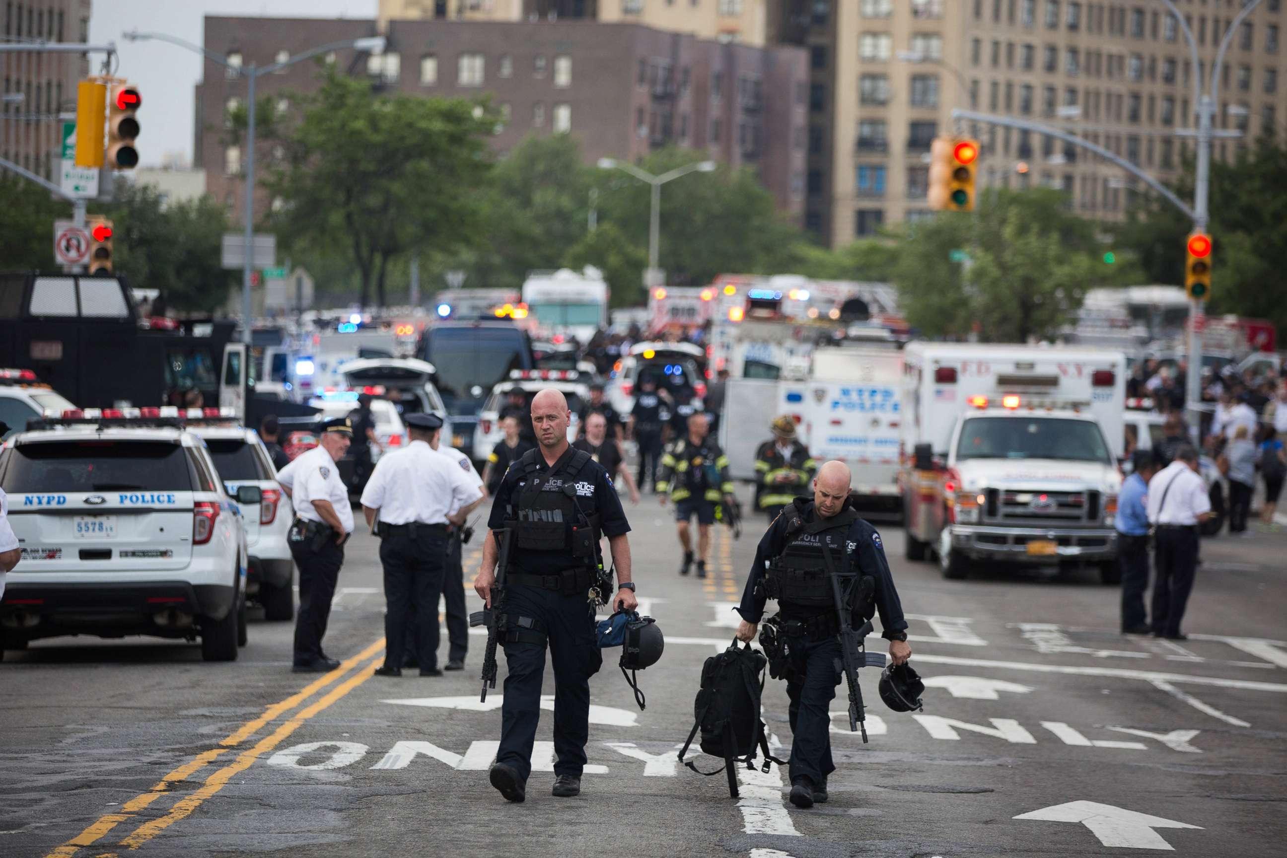 PHOTO: Officers walk away after a shooter opened fire, killing at least one doctor before committing suicide at the Bronx-Lebanon Hospital Center in the Bronx,  New York, June 13, 2017. 