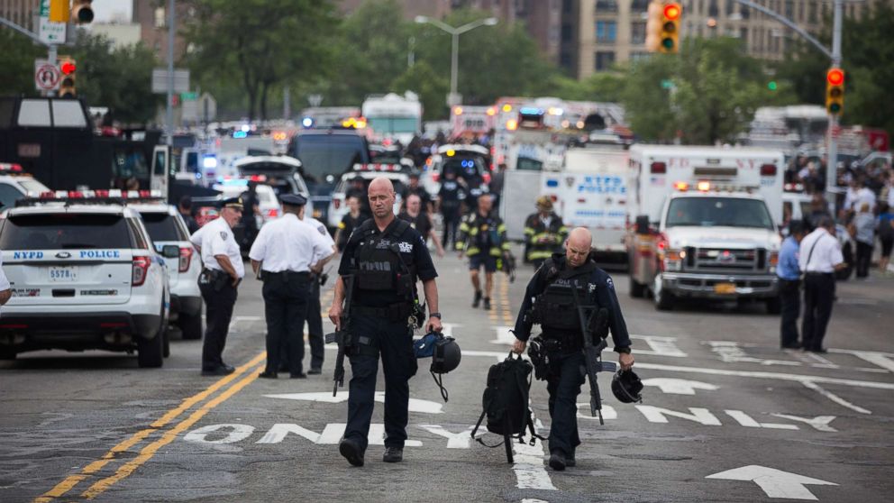 PHOTO: Officers walk away after a shooter opened fire, killing at least one doctor before committing suicide at the Bronx-Lebanon Hospital Center in the Bronx,  New York, June 13, 2017. 