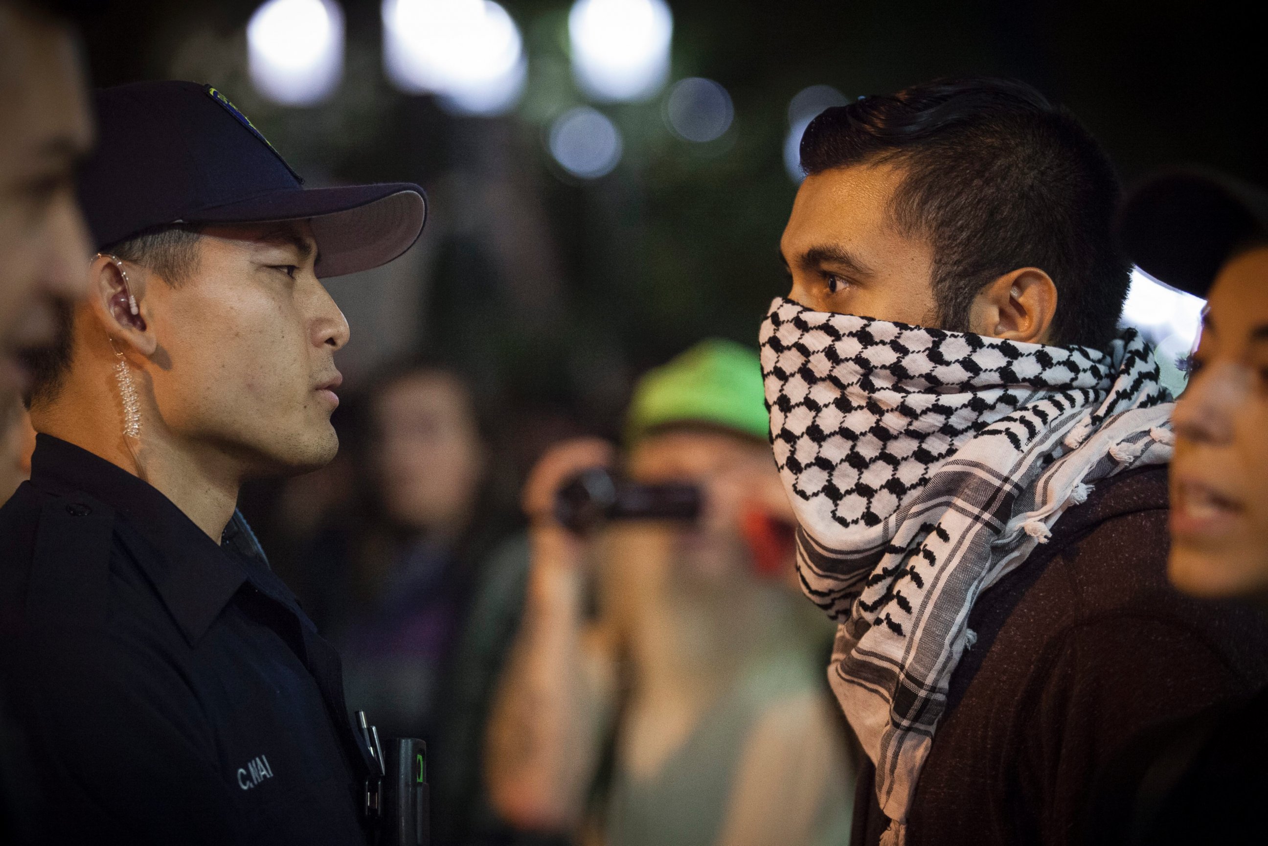 PHOTO: A demonstrator face off with police during a march through the streets in protest against President-elect Donald Trump in Oakland, California, Nov. 10, 2016.