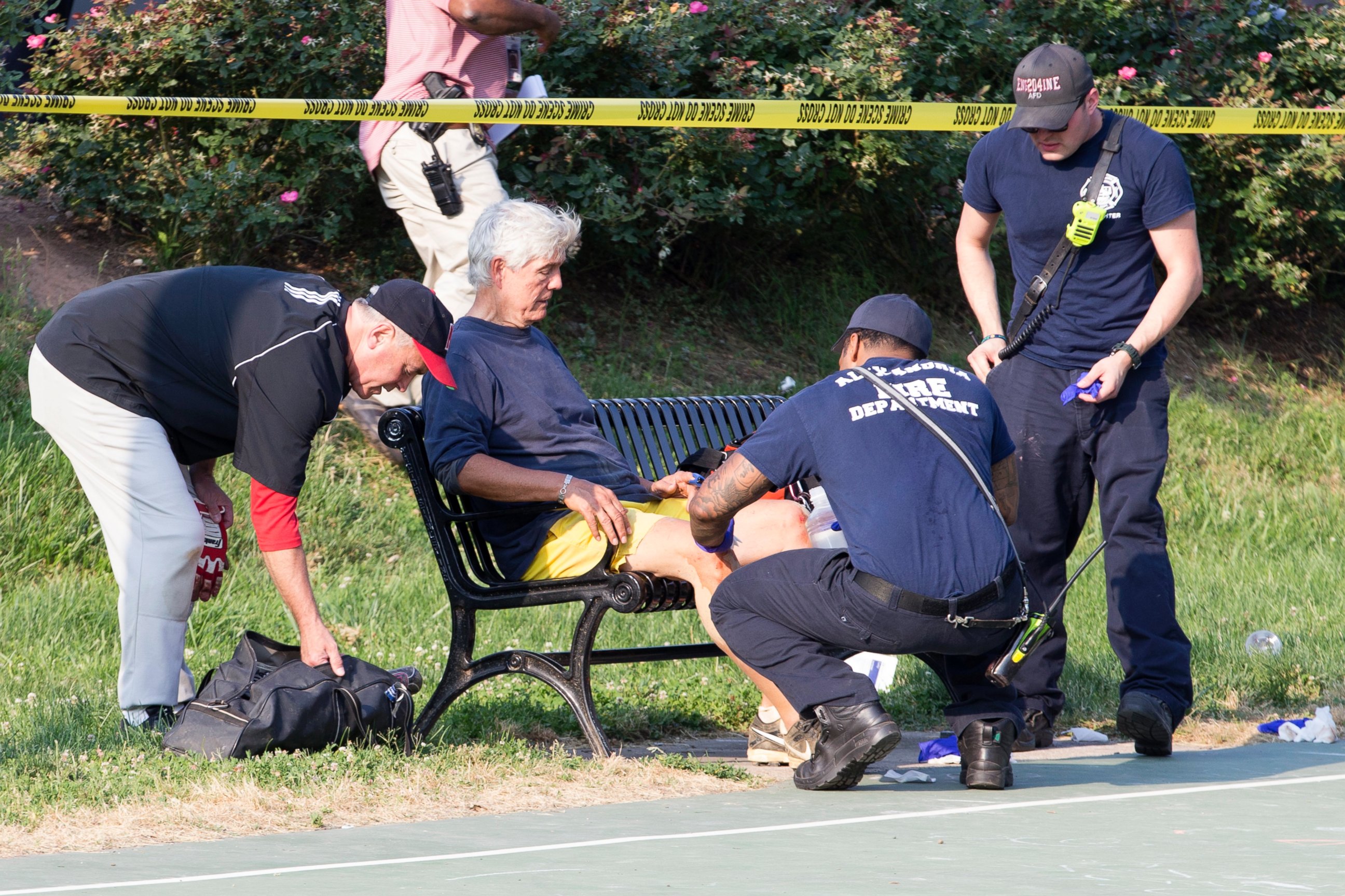 PHOTO: Rep. Roger Williams receives medical attention from first responders on the scene following a shooting in Alexandria, Va., June 14, 2017.