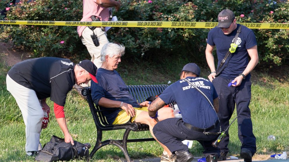 PHOTO: Rep. Roger Williams receives medical attention from first responders on the scene following a shooting in Alexandria, Va., June 14, 2017.