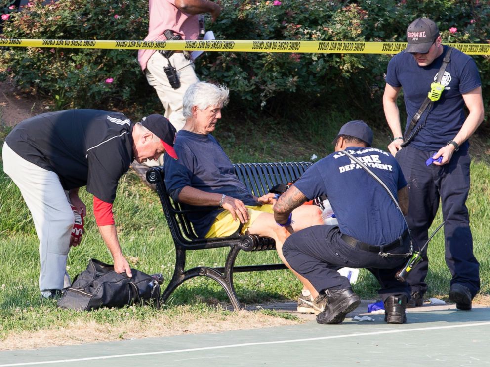 PHOTO: Rep. Roger Williams receives medical attention from first responders on the scene following a shooting in Alexandria, Va., June 14, 2017.