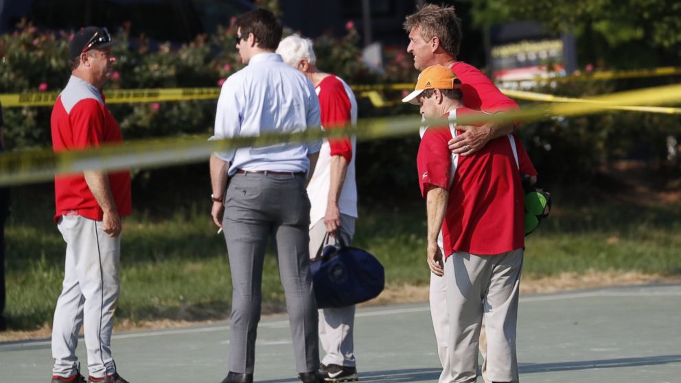 PHOTO: Republican Senator from Arizona Jeff Flake hugs another member of the Republican congressional baseball team following a shooting in Alexandria, Va., June 14, 2017.