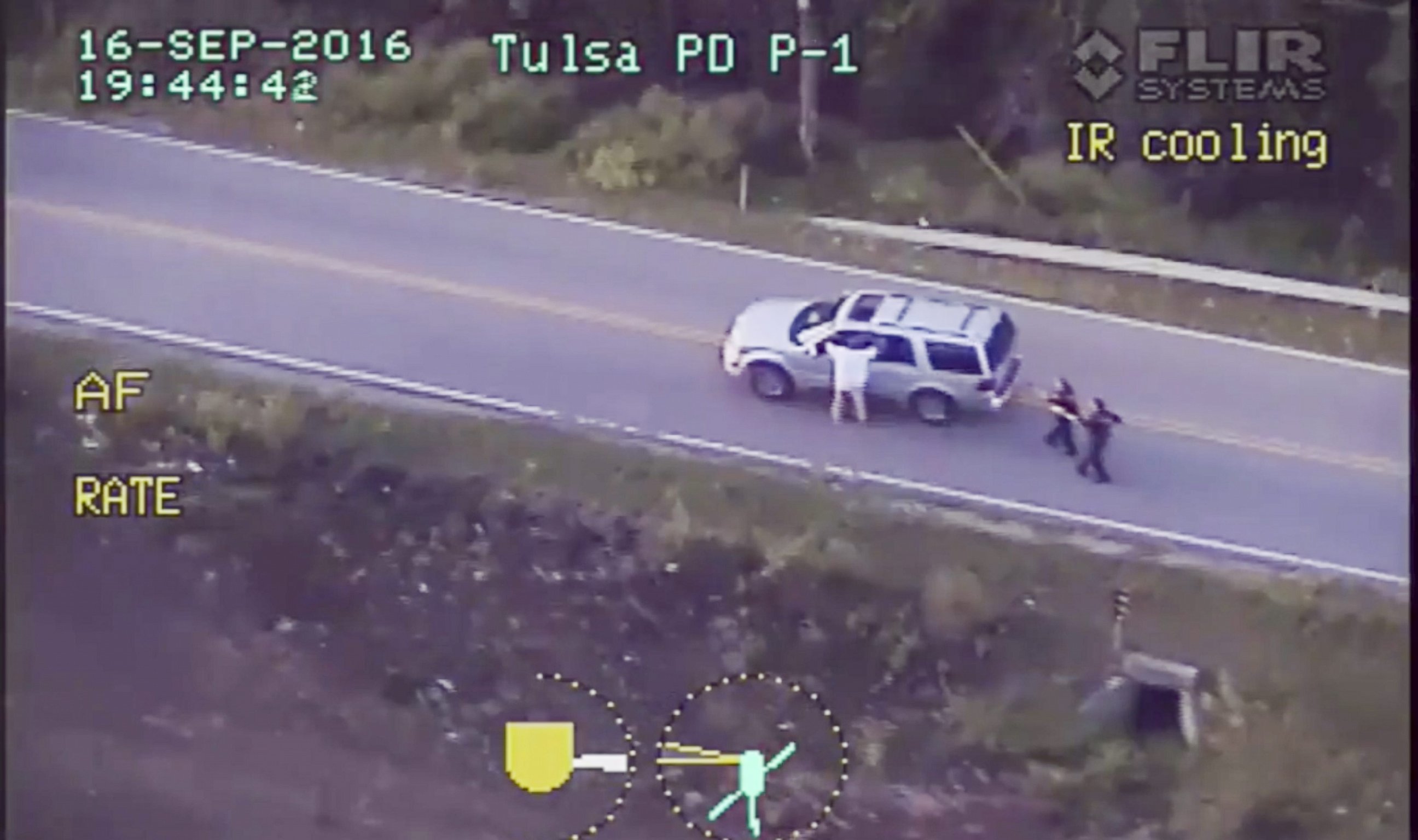 PHOTO: A frame grab from video released by the Tulsa, Oklahoma, Police Department and acquired on Sept. 20, 2016, reportedly shows Terrence Crutcher walking with his hands in the air as he is confronted by police in Tulsa, Oklahoma, on Sept. 16, 2016. 