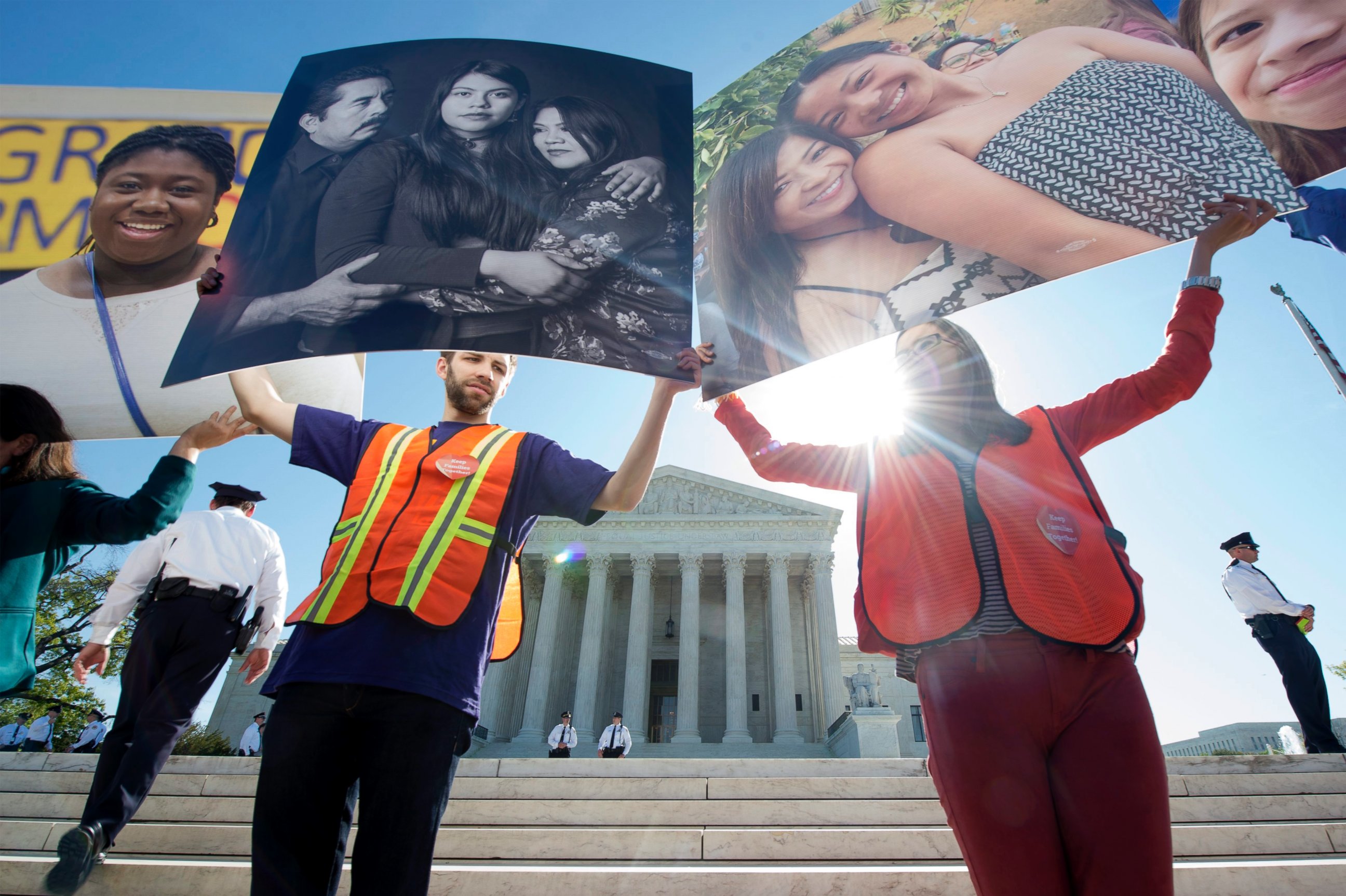 PHOTO:Immigration supporters hold up pictures of people affected by DAPA an DACA at a rally outside the Supreme Court as Justices hear oral arguments in the case of United States v. Texas, April 18, 2016.  