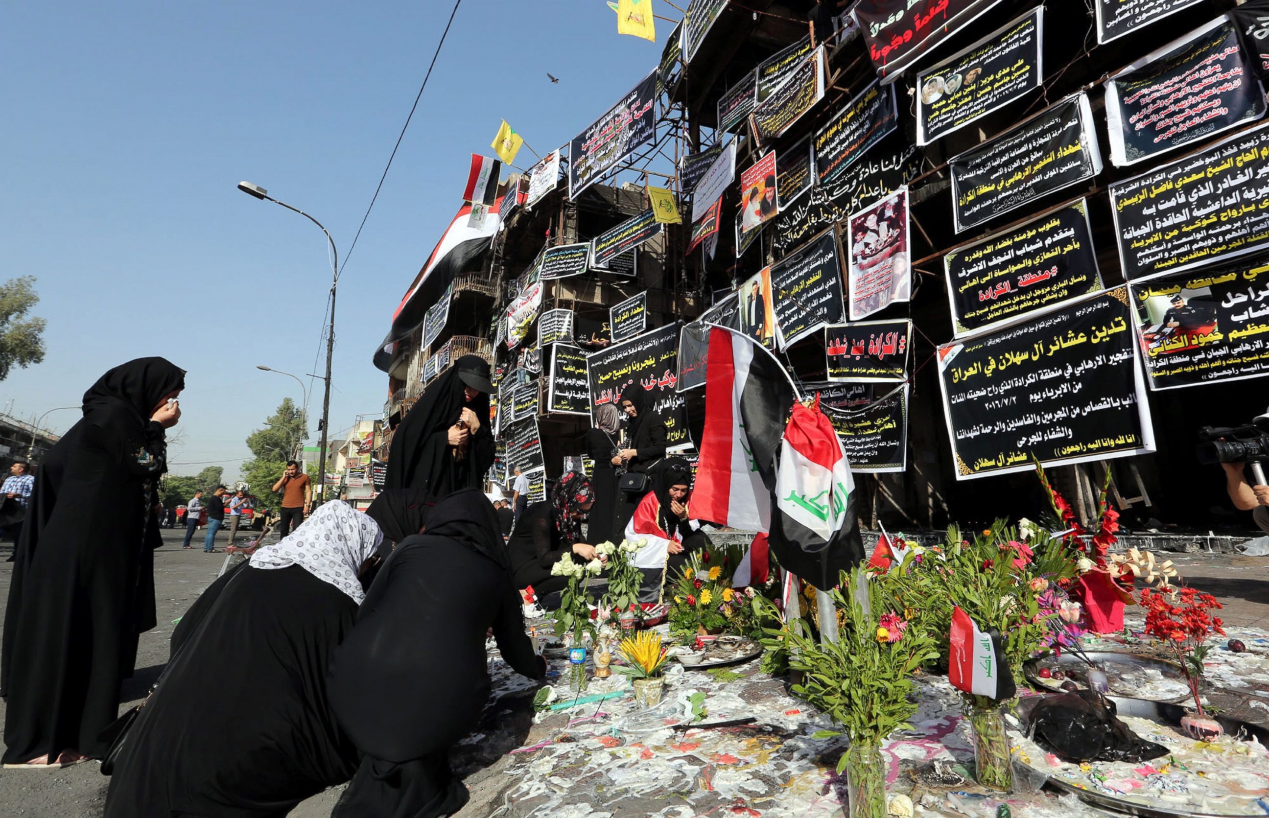 PHOTO: Iraqi women take part in a prayer vigil at the site of a suicide truck bomb attack in Karada district in central Baghdad, Iraq, July 6, 2016.