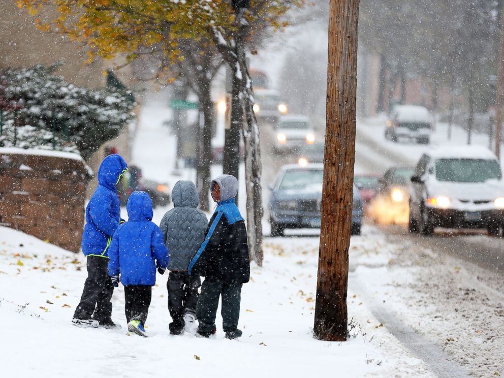 PHOTO: Children walk to school in St. Paul, Minn., during the first snowstorm of the season, Nov. 10, 2014.