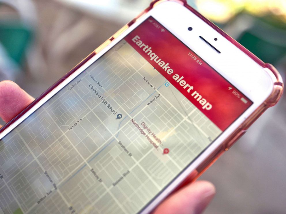 PHOTO: A person looks at an earthquake warning application on their phone in Los Angeles, Jan. 3, 2019. 