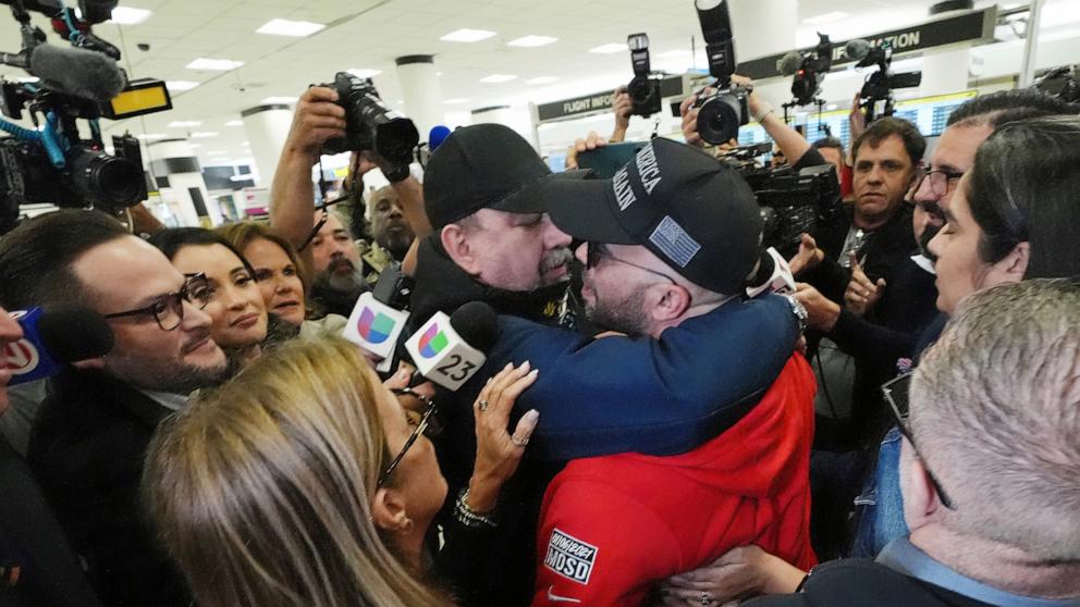 PHOTO: Enrique Tarrio hugged by a supporter after arriving at Miami International Airport, Jan. 22, 2025, in Miami.