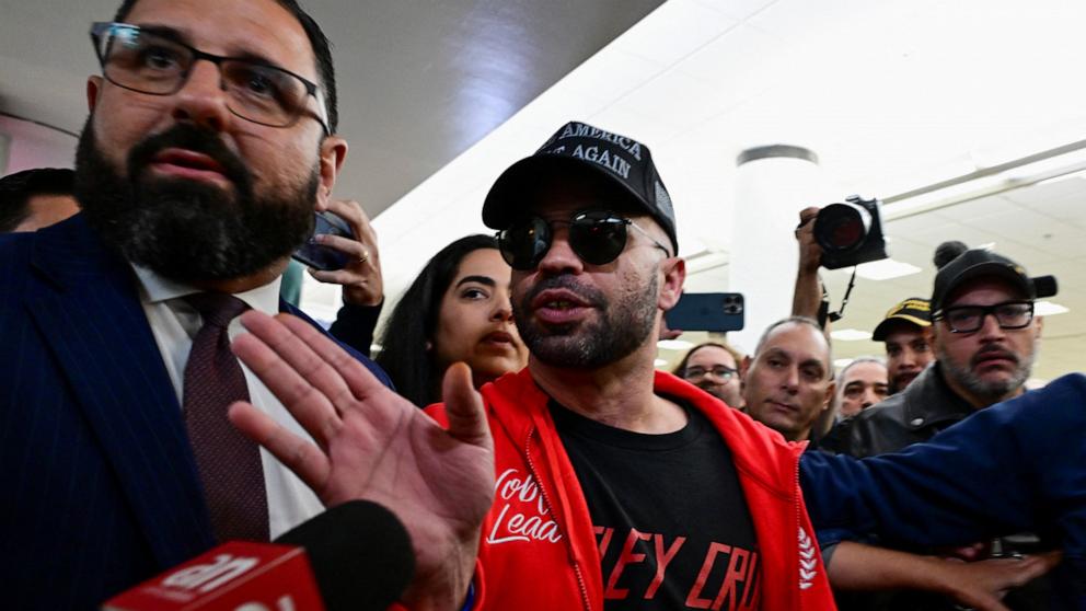 PHOTO: Henry "Enrique" Tarrio, former national chairman of the Proud Boys, who was sentenced to 22 years, gestures as he arrives at Miami Airport after his release from prison, Jan. 22, 2025.