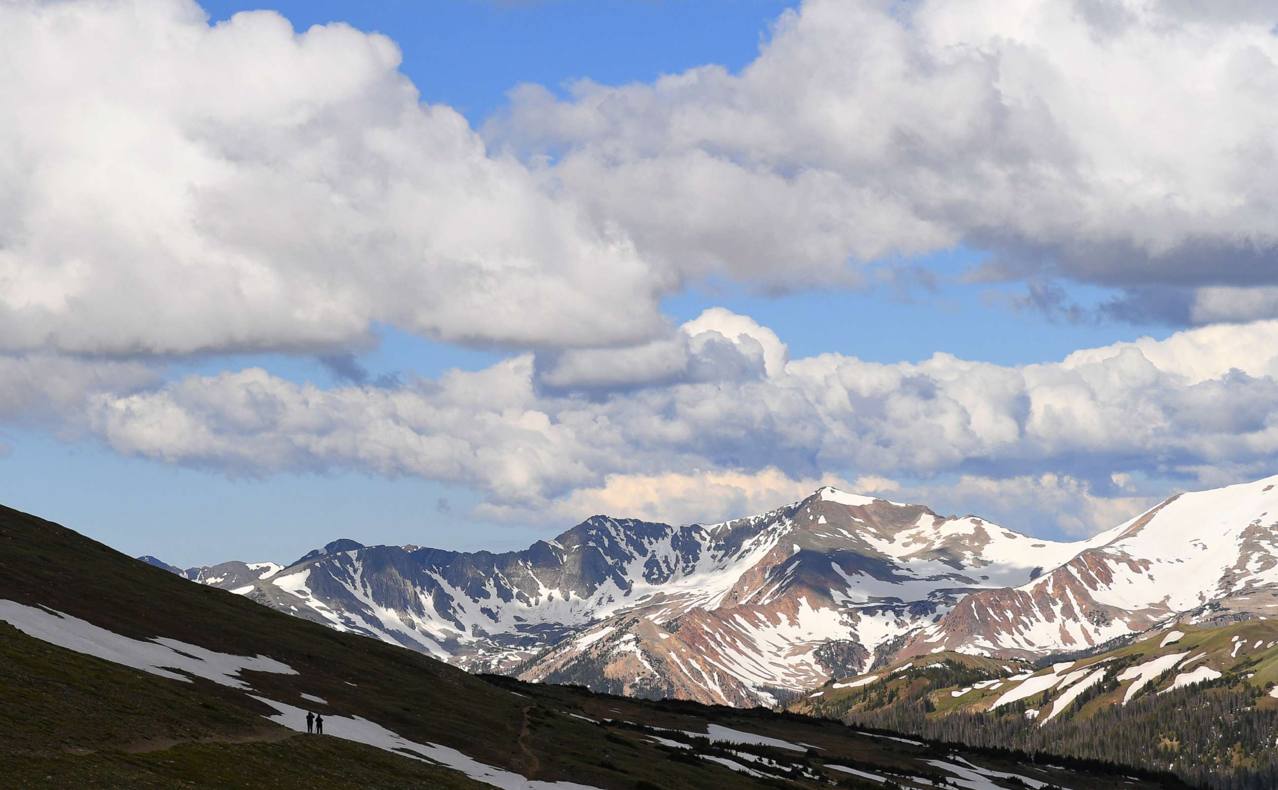 PHOTO: People stop to look at the view from along the top of Trail Ridge Road, June 23, 2020, in Estes Park, Colo., June 23, 2020.