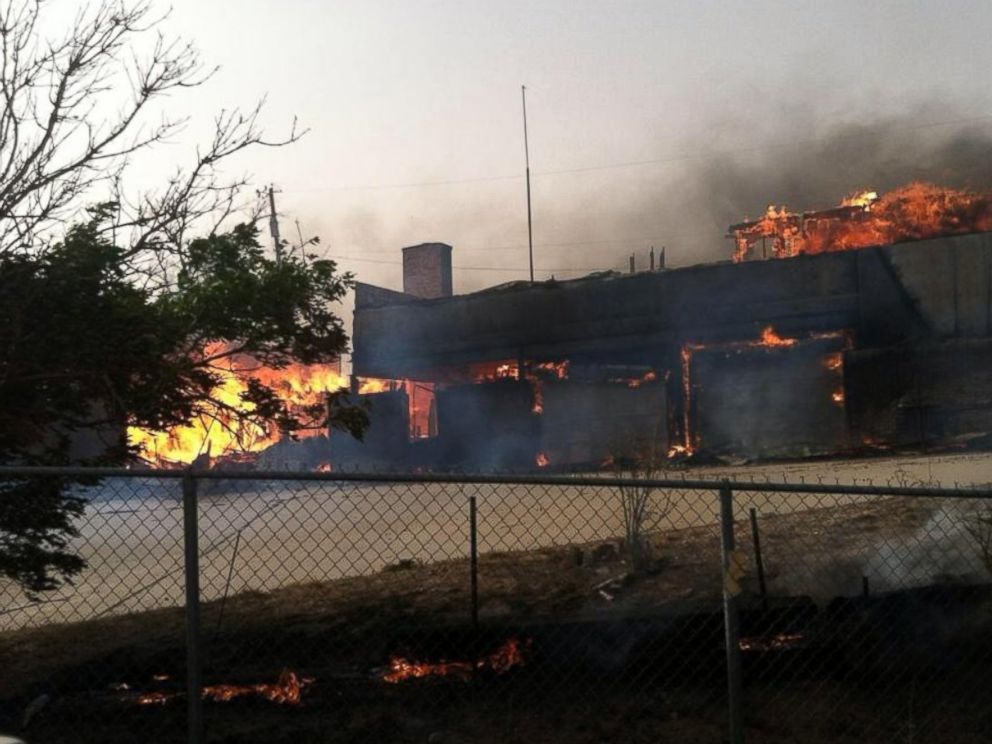 PHOTO: Fire damages a building in Hutchinson County, Texas, May 11, 2014.