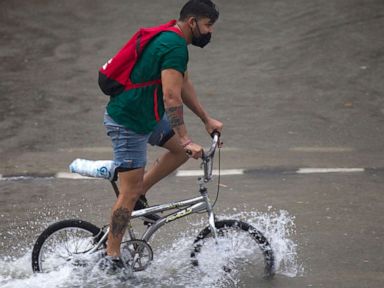Red flag warnings continue in West as flash flooding expected on East Coast
