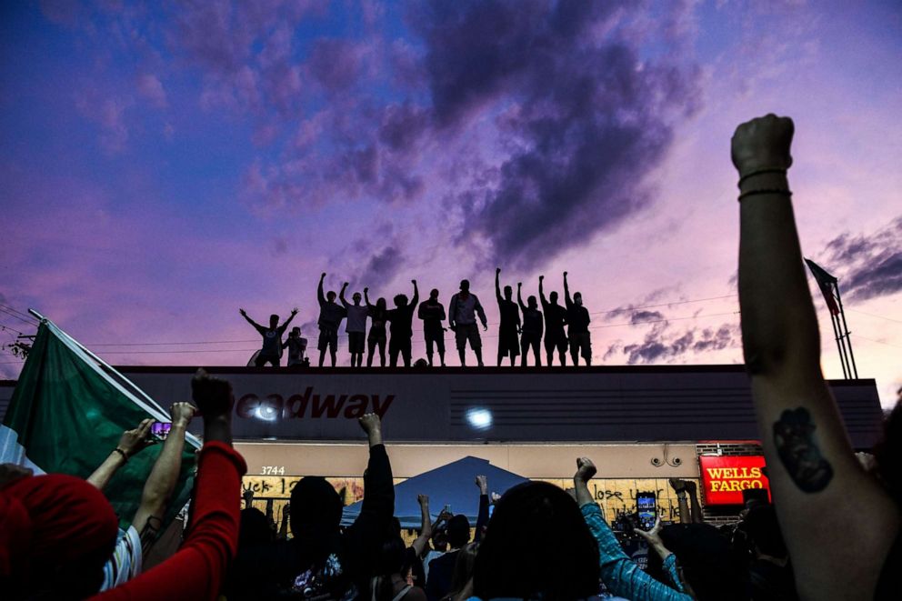 PHOTO: -- AFP PICTURES OF THE YEAR 2020 --

People raise their hands and shout slogans as they protest at the makeshift memorial in honour of George Floyd, on June 2, 2020 in Minneapolis, Minnesota. 