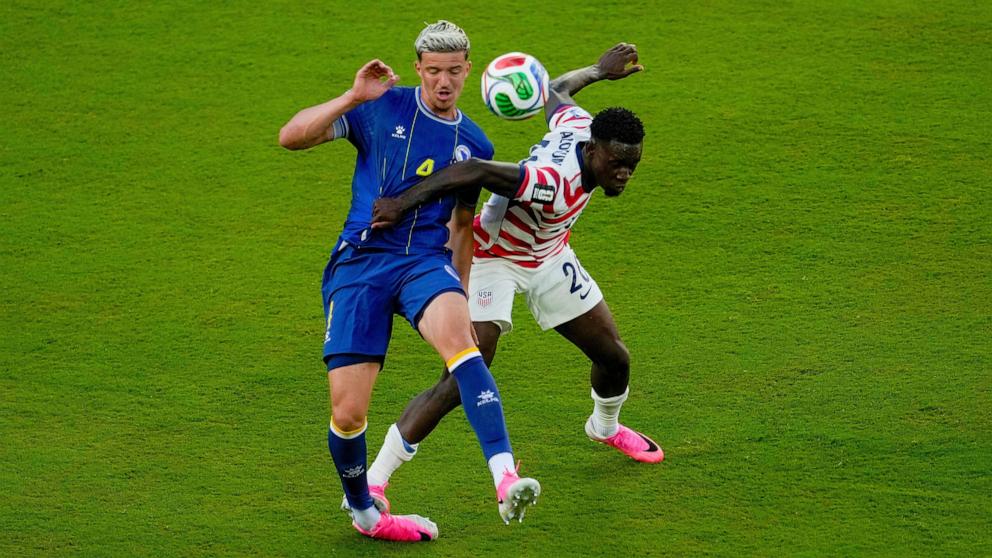 PHOTO: United States' Folarin Balogun fouls Bosnia's Tarik Muharemovic during their FIFA World Cup 2026 round of 32 soccer match in Santa Clara, Calif., July 1, 2026. 